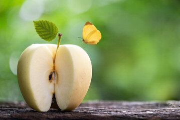 Golden Delicious apple fruit on nature background.