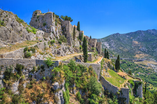 Summer mediterranean landscape - view of the Klis Fortress, which is located near Split on the Adriatic coast of Croatia