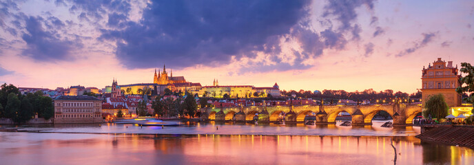 City summer landscape at sunset, panorama, banner - view of the Charles Bridge and castle complex Prague Castle in the historical center of Prague, Czech Republic - obrazy, fototapety, plakaty