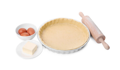 Quiche pan with fresh dough, rolling pin and ingredients isolated on white