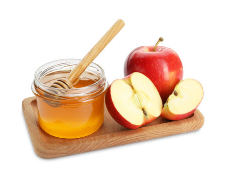 Delicious apples, jar of honey and dipper isolated on white - Powered by Adobe