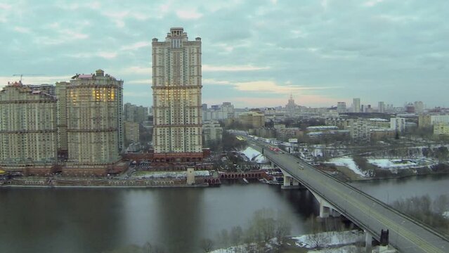 Cityscape with traffic on bridge near residential complex