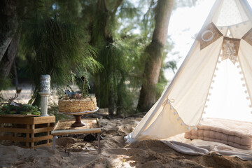 1 year old baby birthday decoration party outdoors on the beach and forest