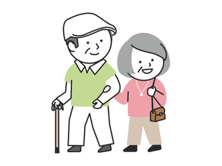 腕を組んで歩いている笑顔のシニアの夫婦