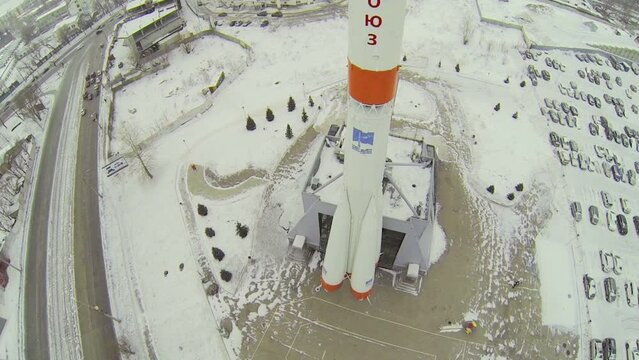 Monument of rocket Soyuz at winter during snowfall. Aerial view