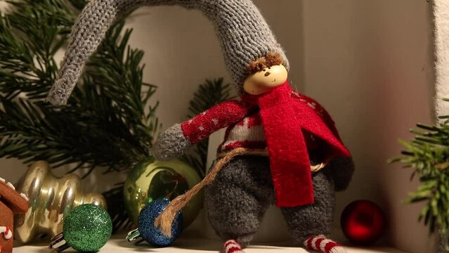 Zoom out of elf sitting on a shelf