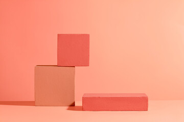 Colorful cubic platforms stand out on a red background. Perfect space for displaying and...