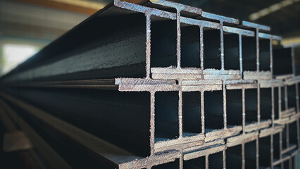 Metal profiled steel beams are packed at the metal products warehouse, H-beam steel and Wi-Frank...