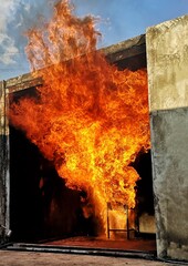 Large-scale fire, simulation of large-scale fire using cooking gas and cooking oil inside the room,...