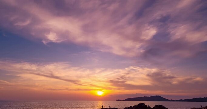 Beautiful 4K Time lapse of Majestic sunset or sunrise clouds sky over sea landscape,Amazing colorful light of nature cloudscape sunrise sky background