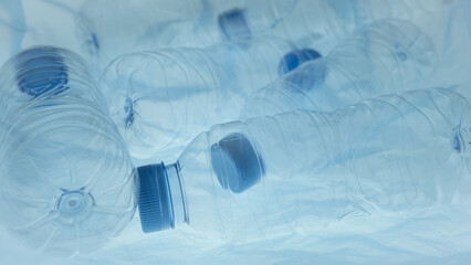 Plastic bottles in plastic bag. Plastic reuse. Waste management. Background of many used empty PET...