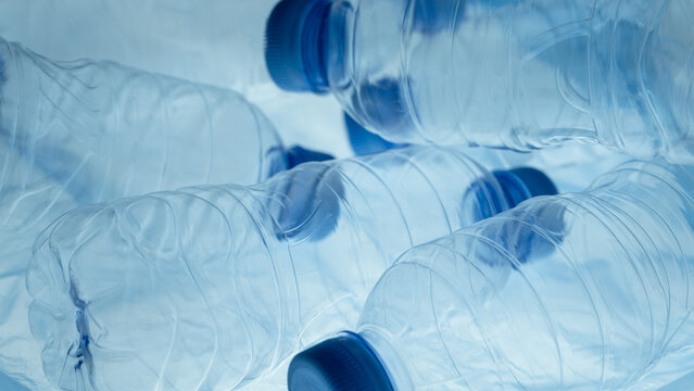 Plastic bottles in plastic bag. Plastic reuse. Waste management. Background of many used empty PET bottles.