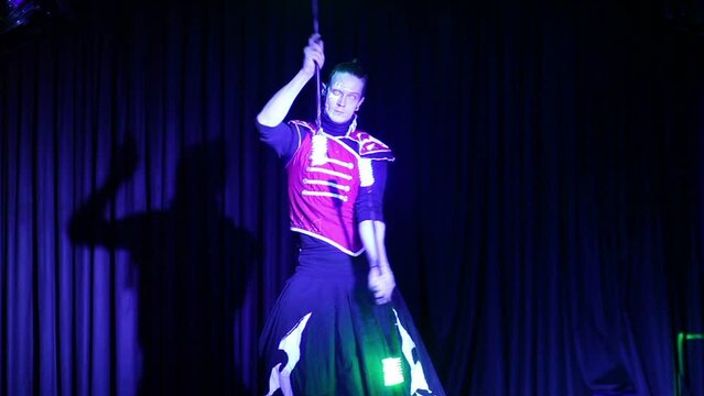 Performance of man in samurai garb with glow sticks 