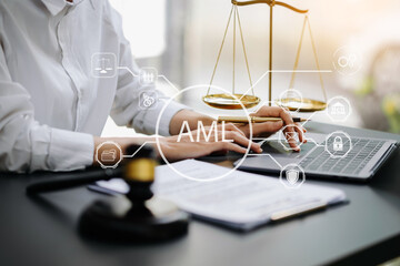 AML Anti Money Laundering Financial Bank Business Concept. judge in a courtroom using laptop and tablet with AML anti money laundering icon on virtual . - obrazy, fototapety, plakaty