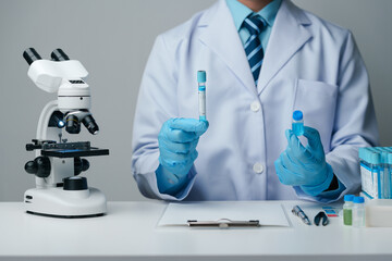 Scientist wearing medical gloves nanotechnology, research, fiber, microbiology, glass, test tube,...