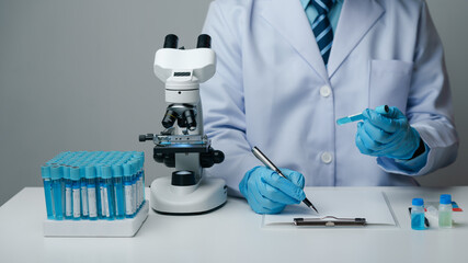Scientist wearing medical gloves nanotechnology, research, fiber, microbiology, glass, test tube,...