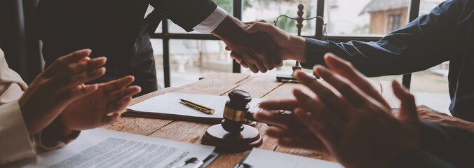Lawyer shaking hands with businessman, investor in financial agreement, partner congratulating...
