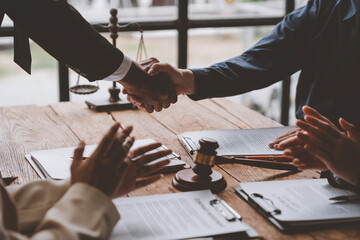 Lawyer shaking hands with businessman, investor in financial agreement, partner congratulating success or lawyer discussing contract agreement. Handshake concept. Agreement.