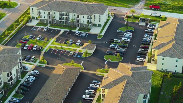 Top view of new apartment condos in Florida suburban area. Family housing in quiet neighborhood. Real estate development in american suburbs