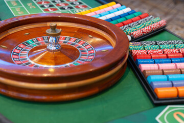 Thrilling casino moment: the classic roulette wheel spins on an elegant table, capturing the excitement of high-stakes gaming in sophisticated surroun