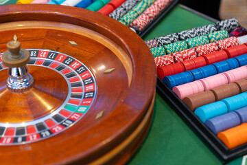 Thrilling casino moment: the classic roulette wheel spins on an elegant table, capturing the...
