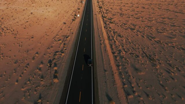 Modern cars driving in the desert on a street from California to Arizona. Cinematic landscape.