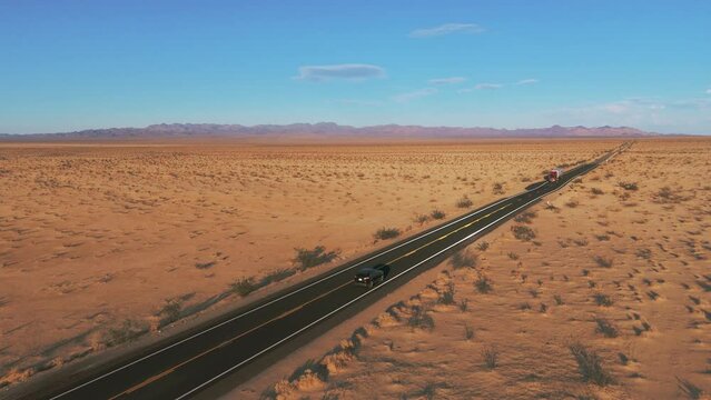 Modern car driving on a street in the desert. Scenic sunset landscape from California to Arizona.