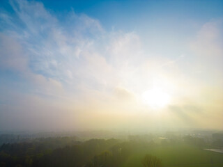 This image exudes the calmness of a hazy morning, with a diffused sunlight washing over the...