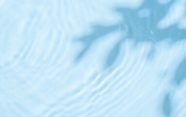 Background summer natural blue texture, clear water with ripples and splashes. Water waves in...