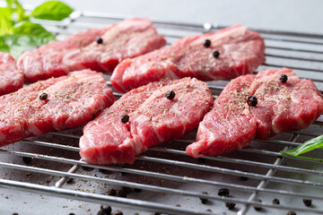 Fresh raw meat on grill plate	