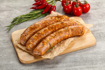 Raw sausages with spices and herbs