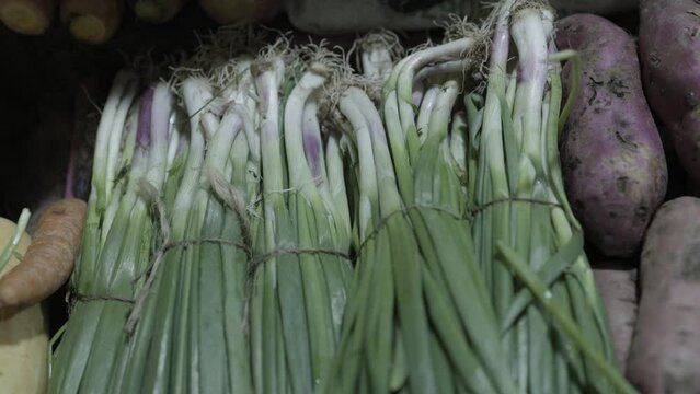 spring onions at vegetable store for sale at evening