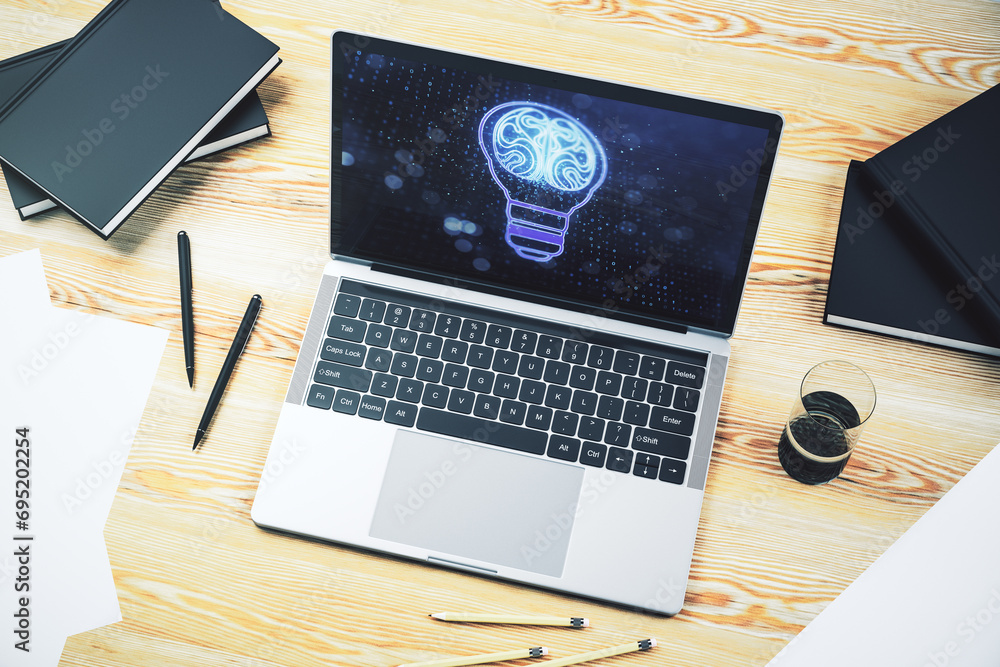 Fototapete creative idea concept with light bulb and human brain illustration on modern laptop screen. neural n