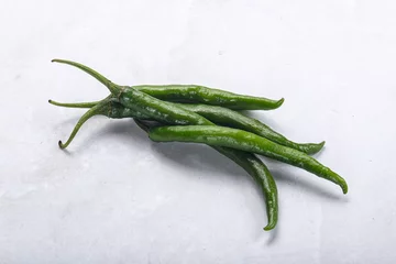 Zelfklevend Fotobehang Hot and spicy green chili pepper © Andrei Starostin