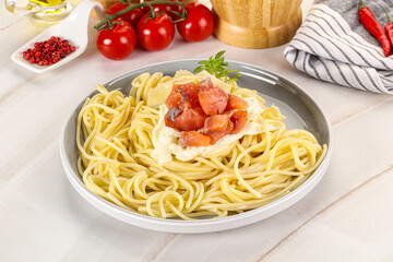Pasta spaghetti with salmon and stracciatella