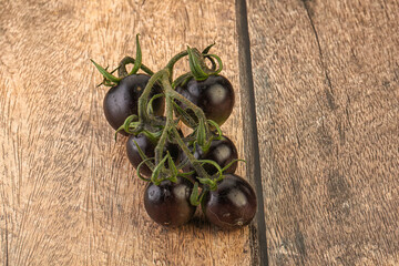 Ripe tasty black cherry tomato