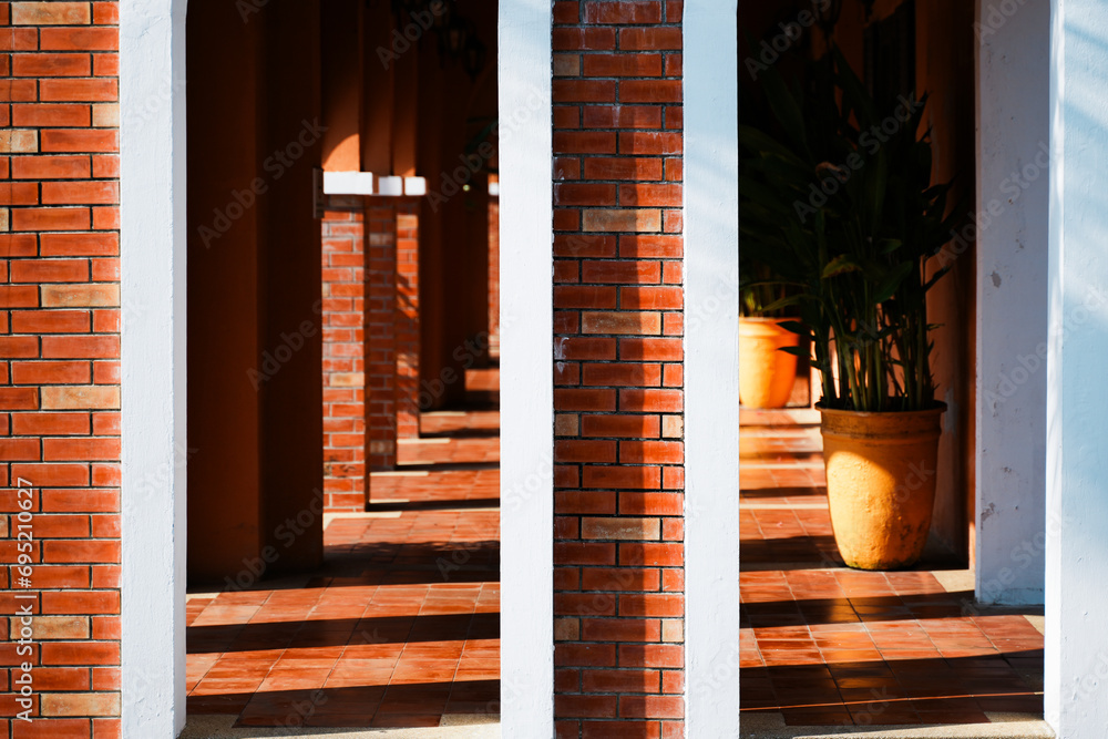 Poster abstract background of brick wall and old building with light and shadow, the door and walk way of b