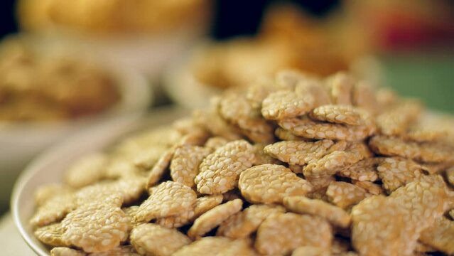 Closeup view of an Indian sweet item called rewri  revdi or sesame seeds sweet  - Lohri festival. Makar Sankranti gajak or Lohri mithai - shahi khasta rewri also known as gur rewadi  gud rewari  re...