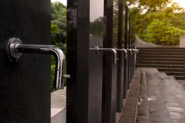 A row of water tap ablution places for Muslims