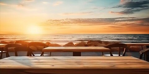 Sunset beach scenery. Captivating image captures serene beauty of sunset at beach. Warm hues of orange and blue dominate sky as sun begins to dip below horizon casting soft glow over tranquil sea - obrazy, fototapety, plakaty
