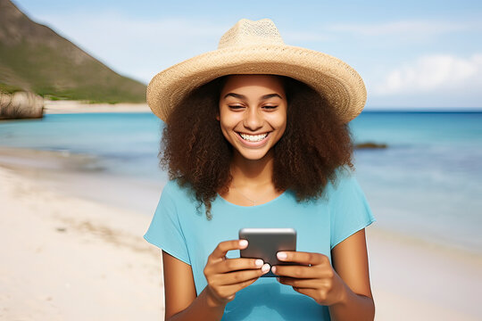 Image generated with AI. Cheerful teenage woman wearing white straw hat on Caribbean beach using smartphone