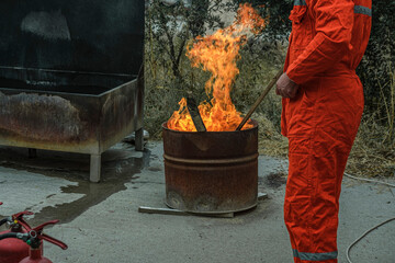 stcw firefighting prevention training, man and open fire in a barrel, maritime courses