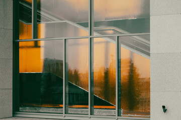 Abstract background of glass on the windows in a building in orange