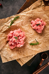 Garlic, salt, and decorated pork sirloin on the cutting board