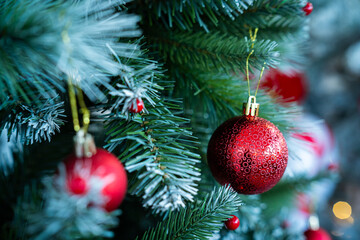 Merry x-mas,Close up of Colorful balls ,gifts box and Christmas greeting picture parcel,bell decoration on Green Christmas tree background Decoration During Christmas and New Year.