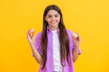 teen girl sweet tooth hold yummy french macaron or macaroon cookie