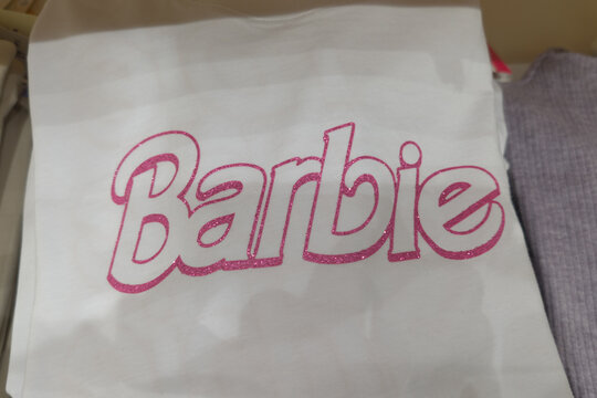 Barbie Doll Pink Logo Brand And Text Sign On Advertising Shirt For Sale Toy Of Blond Hair