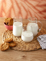 milk in a glass and a decanter is on the table