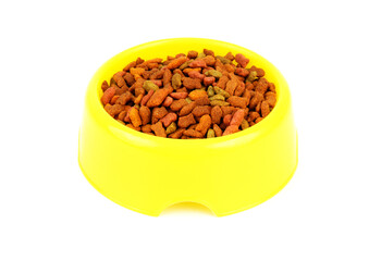 Yellow bowl with cat food on isolated white background.	