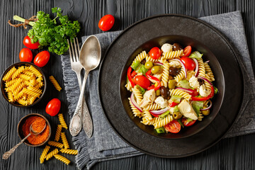 fusilli salad with mozzarella, veggies in a bowl